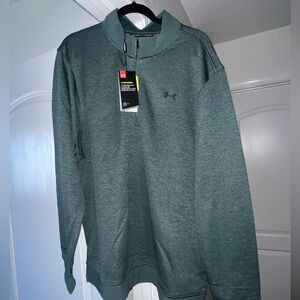 Under Armour, men’s green UA Storm SweaterFleece 1/4 zip